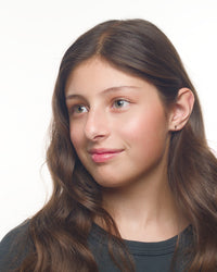 Angelina gold lightning earrings worn by a Latina model