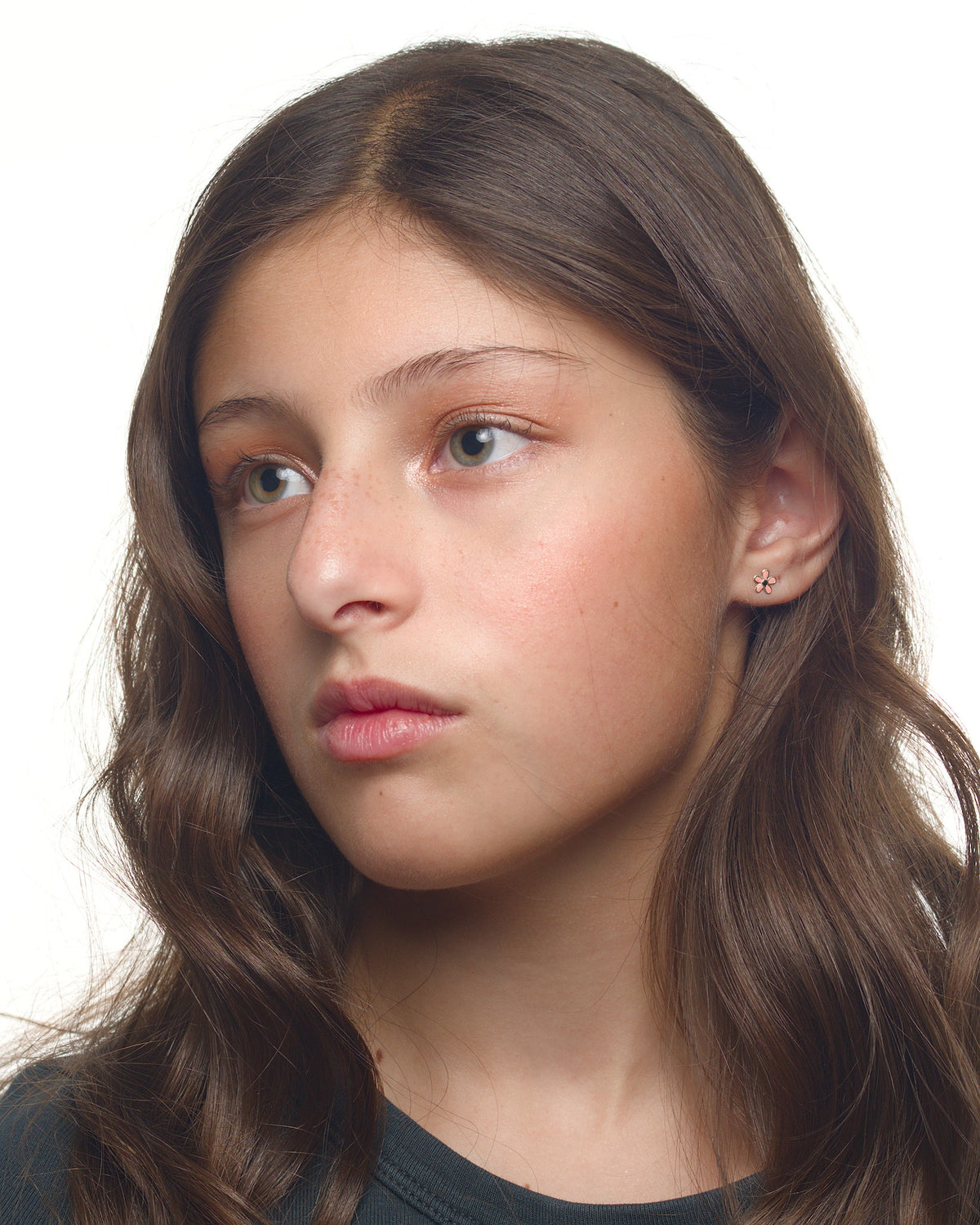 Arabella flower earrings worn by a Latina tween model