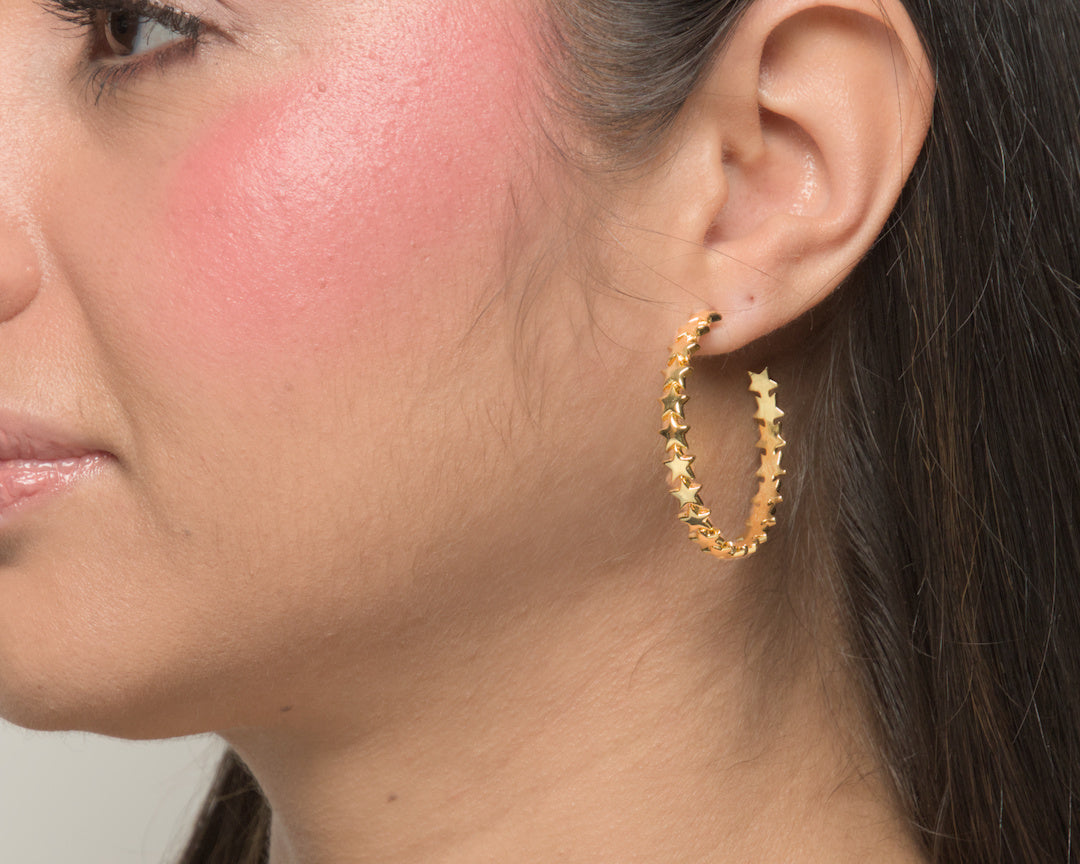 Baby Bri hoop earrings by coco + peach jewelry worn by a Latina model