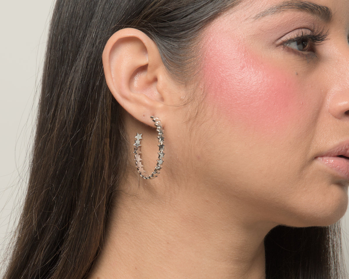 Baby Bri hoop earrings by coco + peach jewelry worn by a Latina model