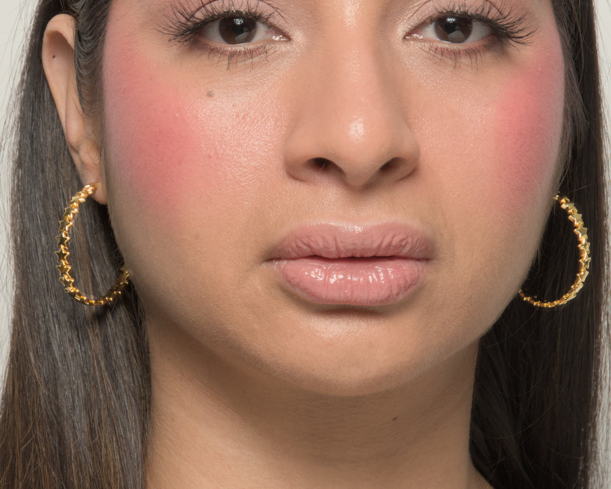 Baby Bri hoop earrings by coco + peach jewelry worn by a Latina model