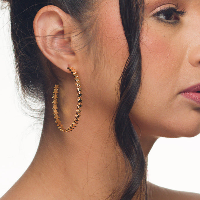 Bri star hoop earrings by coco + peach jewelry worn on a Latina model