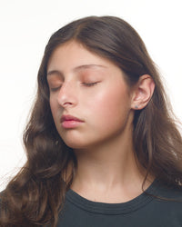 Caroline kitty earrings worn by a Latina tween model
