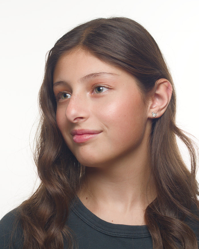 Emma unicorn earrings worn by a Latina tween model