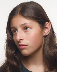 Franny lightning bolt earrings worn by a Latina tween model