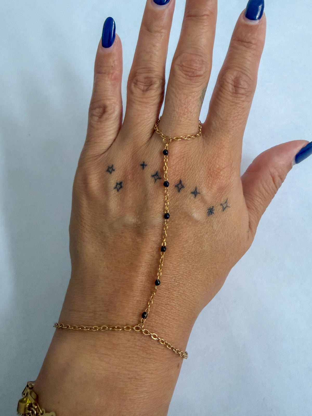 Heather hand chain bracelet by coco + peach jewelry worn on a model