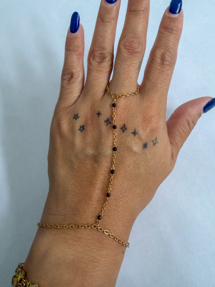 Heather hand chain bracelet by coco + peach jewelry worn on a model