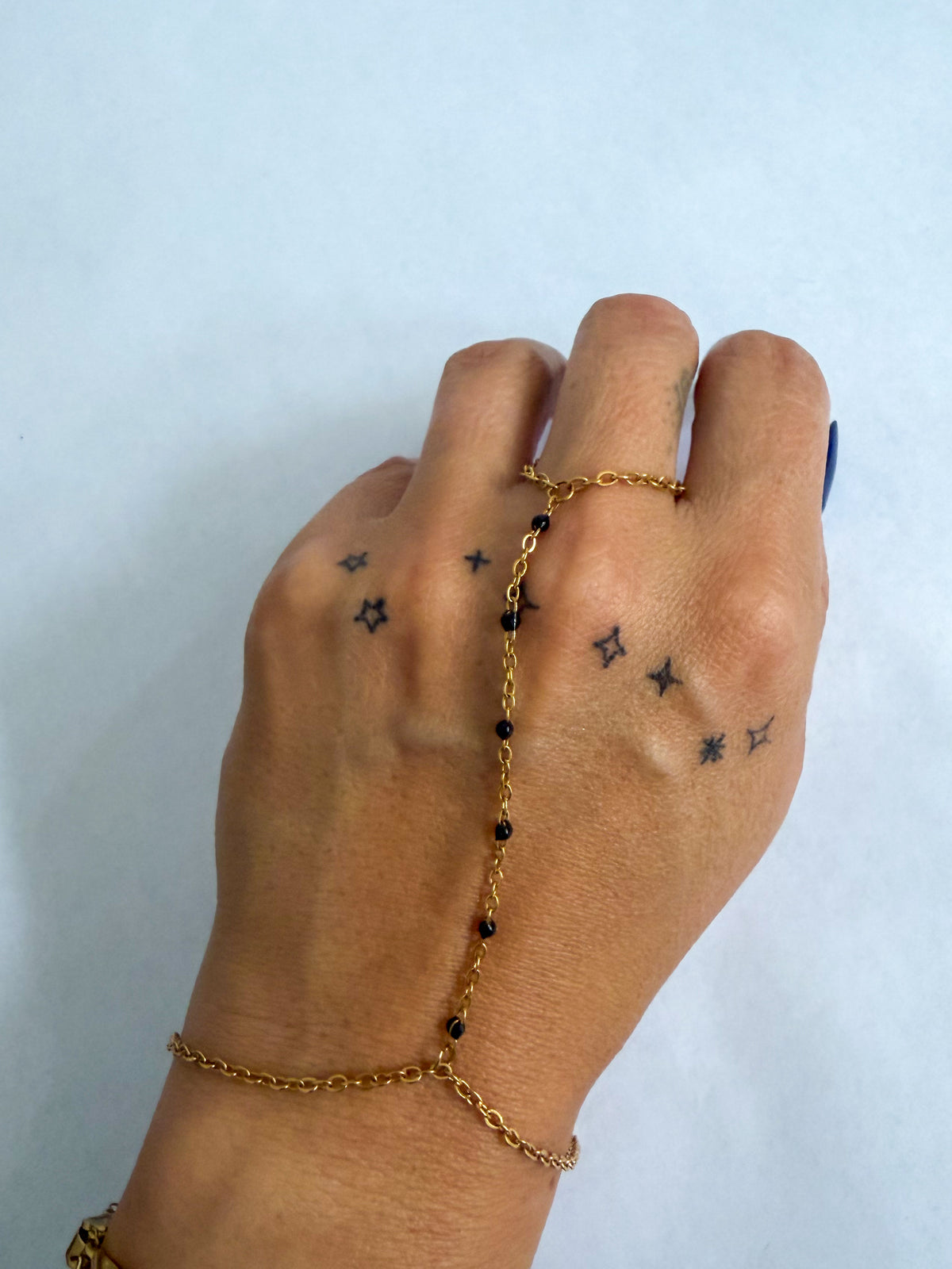 Heather hand chain bracelet by coco + peach jewelry worn on a model