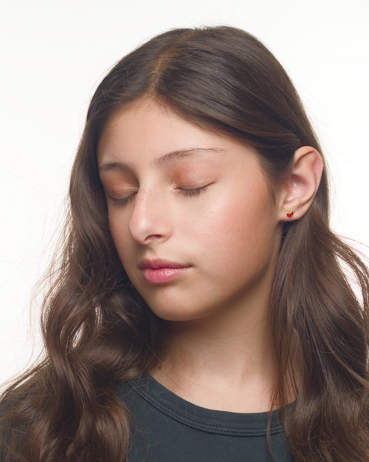 Maia strawberry earrings worn by a Latina model