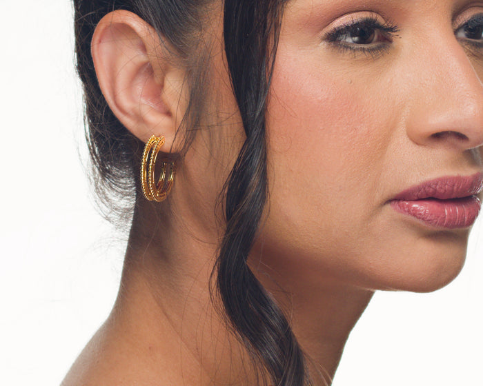 Marie midi hoop earrings by coco + peach jewelry worn by a Latina model