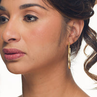 Meg hoop earrings by coco + peach jewelry worn by a Latina model