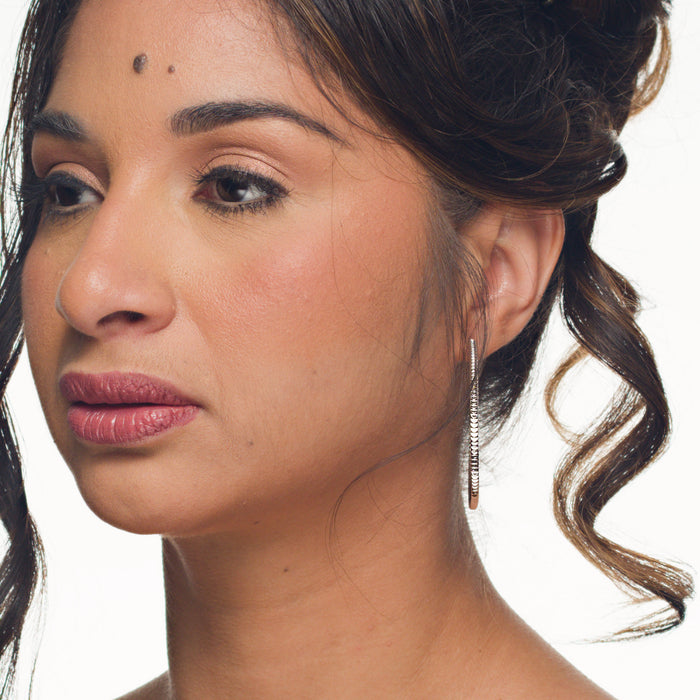 Meg hoop earrings by coco + peach jewelry worn by a Latina model