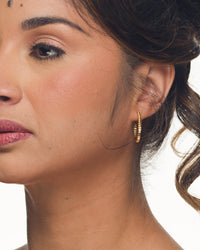 Mini Meg hoop earrings classic everyday jewelry by coco + peach jewelry worn by a Latina model