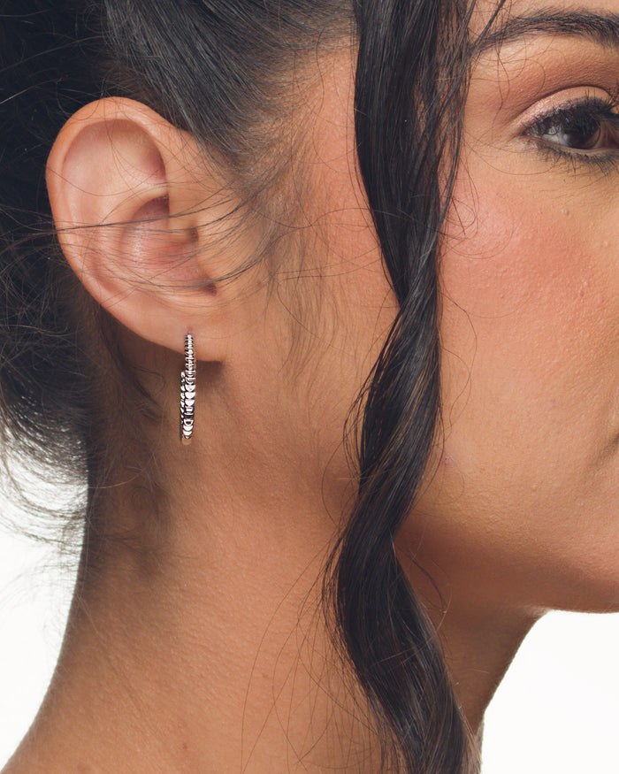 Mini Meg hoop earrings classic everyday jewelry by coco + peach jewelry worn by a Latina model