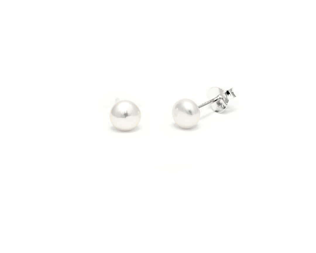 Nelly pearl earrings up close product photo