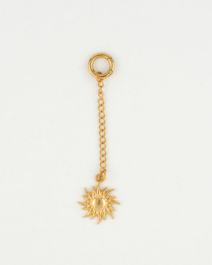 gold bikini charm with sunshine charm close up from the Playa Babe collection