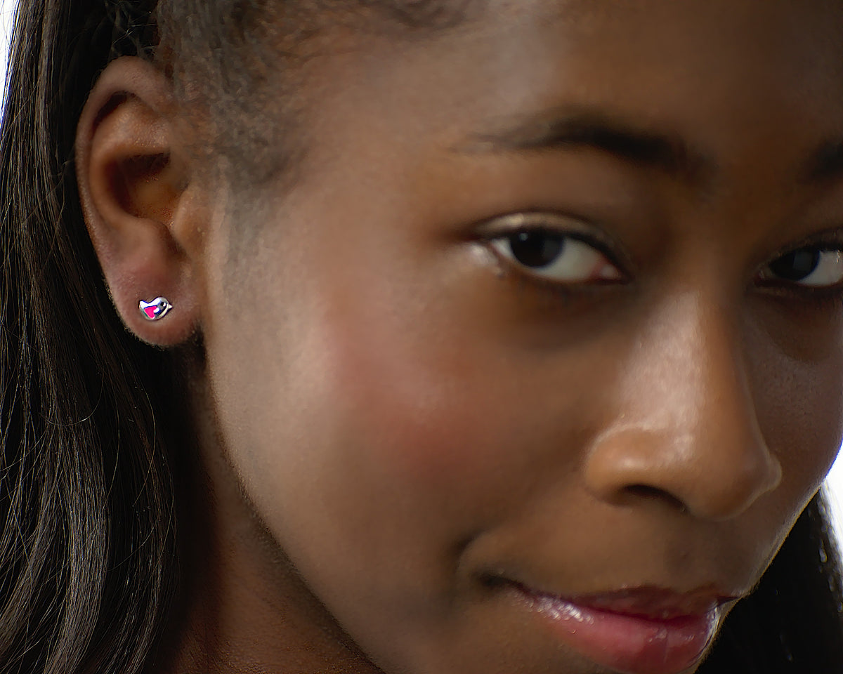 Kendall birdie earrings worn by a tween model