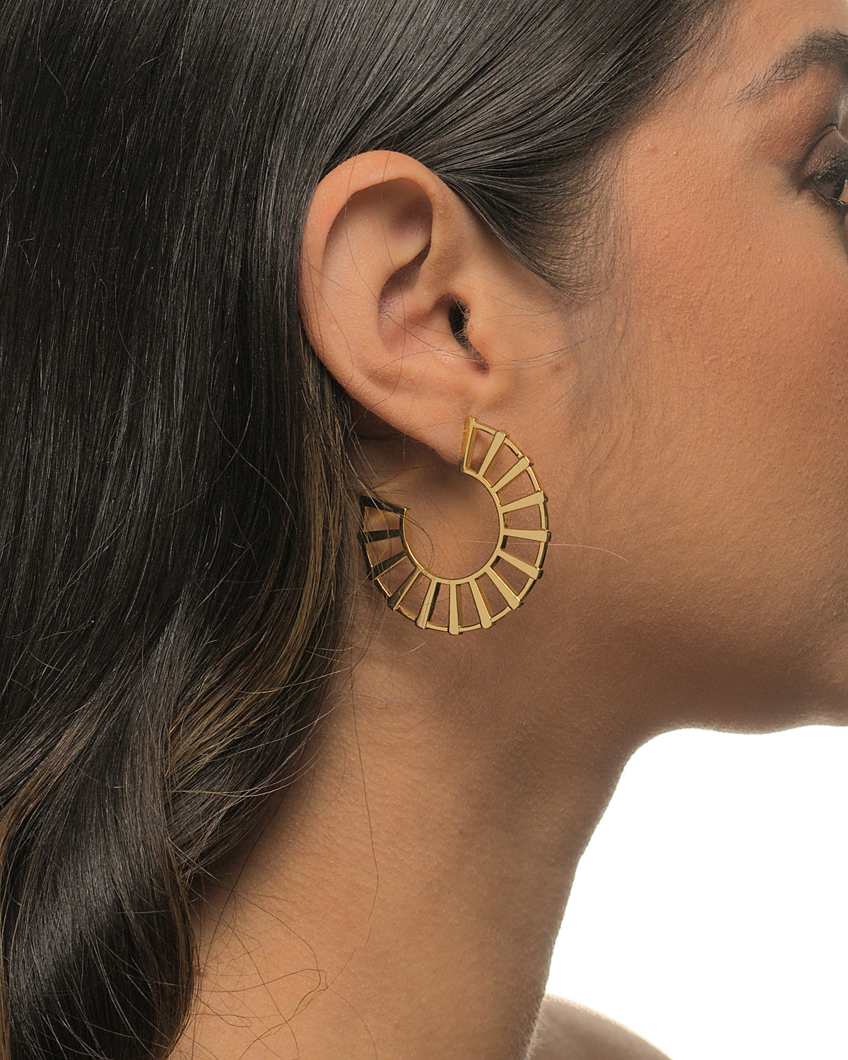 Michelle fan earrings by coco + peach jewelry worn by a Latina model