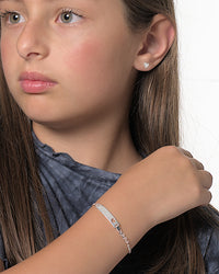 Viviana silver heart stud earrings worn by a Latina kid model